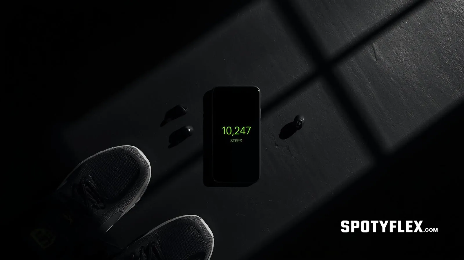 Smartphone showing step counter app with 10,247 steps alongside walking shoes