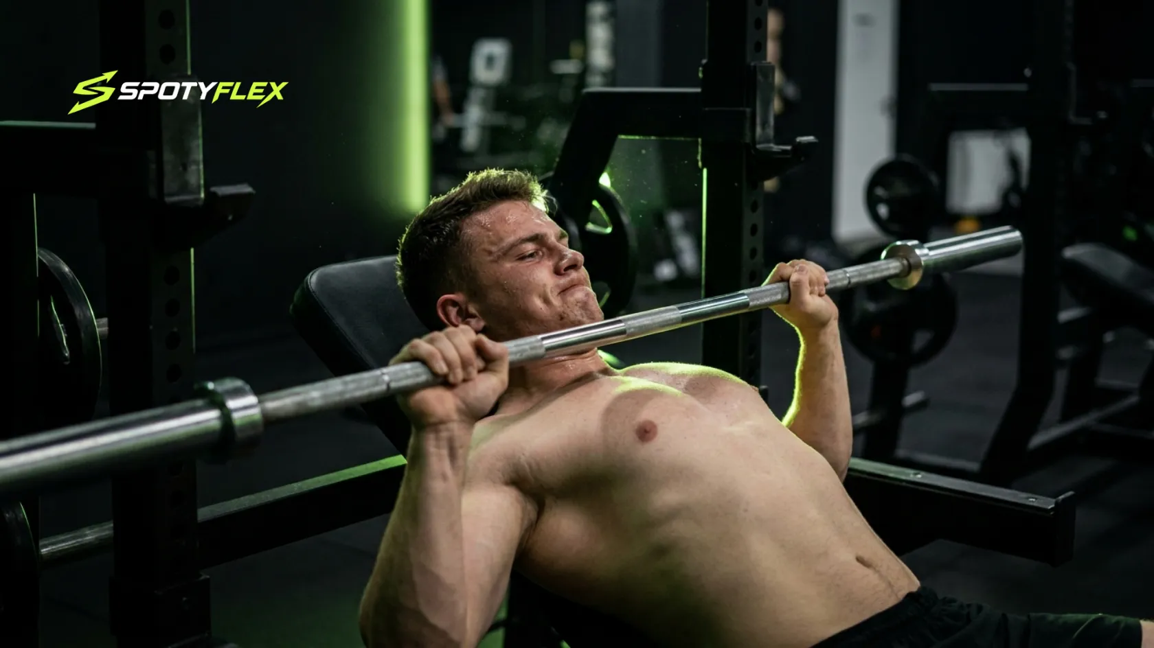 Athlete performing barbell bench press for chest training