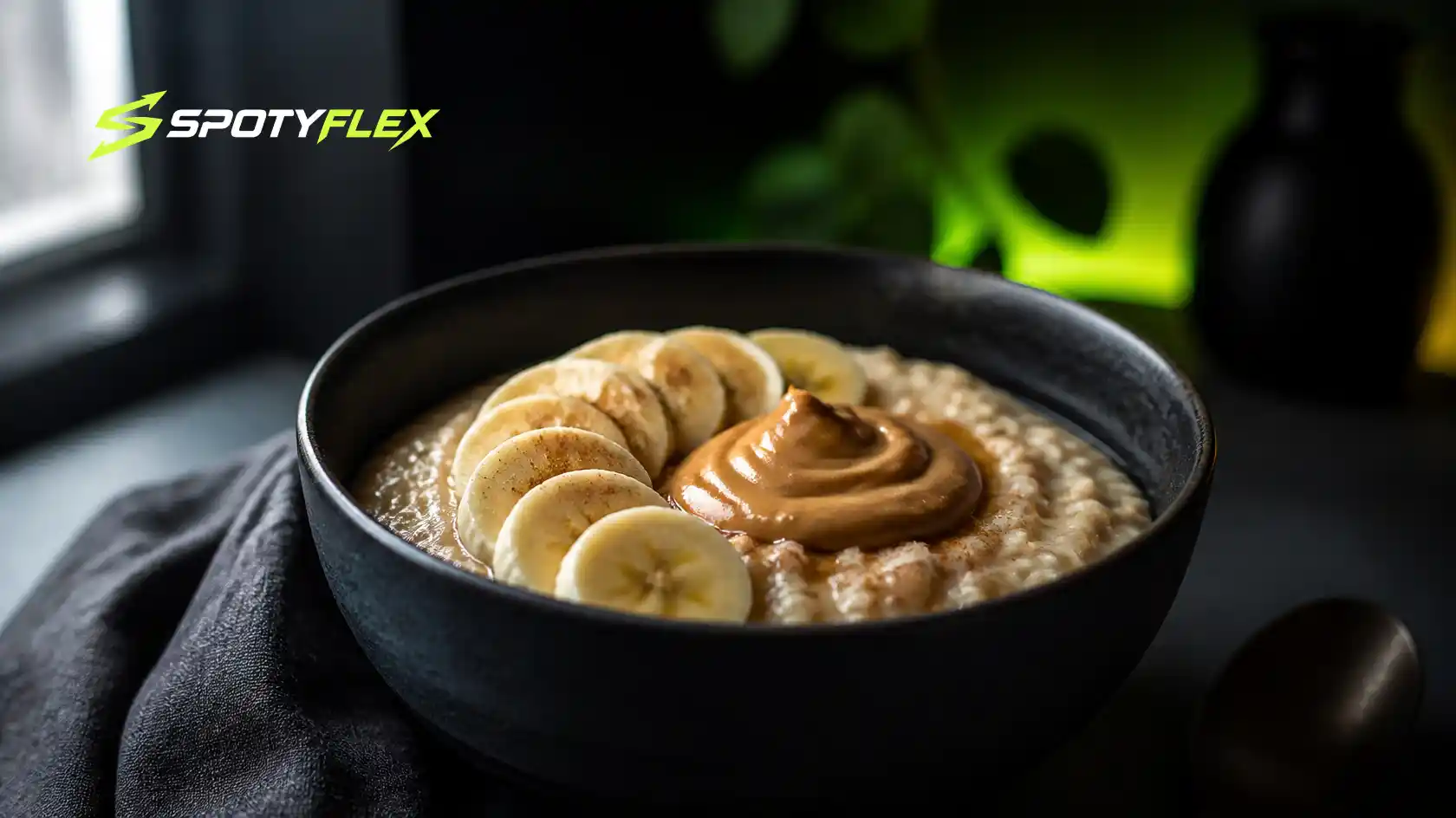 A bowl of oats topped with banana slices and peanut butter.